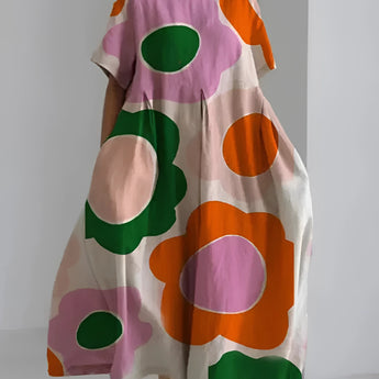 Eco-friendly oversized floral dress in white with green leaf print, featuring pink accents, designed for plus-size fashion with 4XL fit.