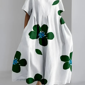 Eco-Friendly Oversized Floral Dress in white with a green leaf print, featuring a round neck and short sleeves, available in size 4XL.