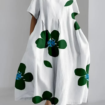 Eco-Friendly Oversized Floral Dress in white with a green leaf print, featuring a round neck and short sleeves, available in size 4XL.