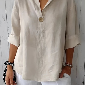 Eco-friendly v-neck linen blouse in white, featuring a lightweight design perfect for summer with short sleeves and a fashionable, relaxed fit.