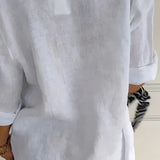Eco-friendly V-neck linen blouse in white, showcasing a lightweight summer design with elbow-length sleeves and tailored waist, suitable for a stylish and sustainable fashion choice.