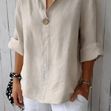 Eco-friendly V-neck linen blouse in white, featuring a lightweight design ideal for summer. The blouse has long sleeves, a collar, and a relaxed fit at the waist.