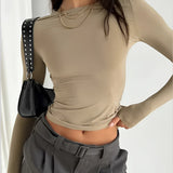 Electric blue women's cropped long sleeve crew neck top in persimmon color, size XL, highlighting the neckline, sleeves, and waist area.