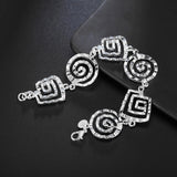 Elegant 925 sterling silver geometric bracelet with adjustable clasp, featuring circular and patterned design elements.