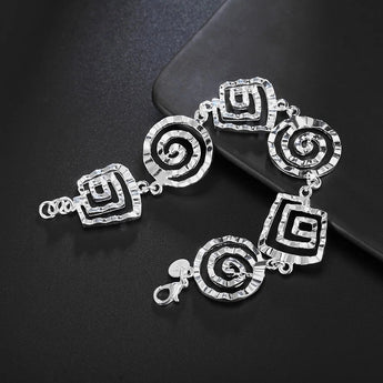 Elegant 925 sterling silver geometric bracelet with adjustable clasp, featuring circular and patterned design elements.