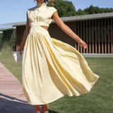 Elegant black midi dress with a back cutout, featuring a fitted waist and short sleeves, suitable for evening wear.