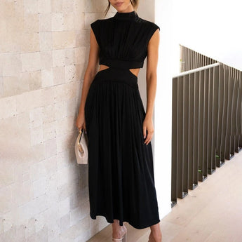 Elegant black midi dress featuring a stylish back-cutout design, suitable for evening wear, shown in size XL. The dress highlights the shoulders and waist with its elegant cut and has a sophisticated, one-piece garment structure with sleeves for added style.