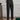 Elegant beige high-waisted pleated trousers for women, designed for office wear, shown in a full-body view highlighting the waist, thigh, and knee areas.