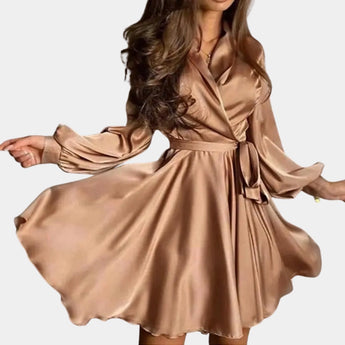 Elegant beige satin wrap dress with long sleeves, styled as a mini party dress in brown, size XL, featuring a defined waist and thigh-length hemline.