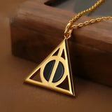 Elegant Black Agate Deathly Hallows Gold Pendant Necklace featuring a gold triangular pendant with an amber-tinted black agate stone, symbolizing the Deathly Hallows.