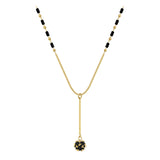 Elegant black gemstone pendant necklace with gold chain, featuring a circular symmetrical design.