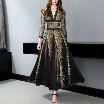 Elegant black and gold embroidered lace evening gown maxi dress featuring intricate lace detailing, fitted waist, elegant neckline, and full-length sleeves, modeled by a fashion model.