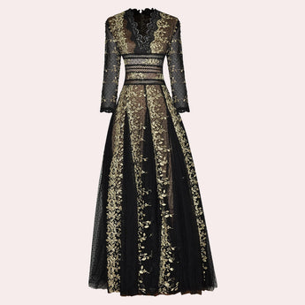 Elegant black and gold embroidered lace evening gown maxi dress with long sleeves, suitable for formal occasions. The dress features intricate embroidery, a fitted waist, and a floor-length design.