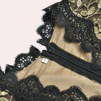 Elegant black and gold embroidered lace evening gown maxi dress with intricate patterns and long sleeves.