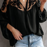 Elegant black lace blouse featuring sheer sleeves and intricate floral embroidery, displayed in Nero color and 3XL size, highlighting its fashion-forward design and attention to detail.