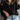 Elegant black lace blouse featuring sheer sleeves and intricate floral embroidery, displayed in Nero color and 3XL size, highlighting its fashion-forward design and attention to detail.