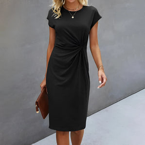 Elegant black midi dress with a sheath design, featuring a knee-length hem, pockets, and a flattering fit that highlights the waist, shoulders, and neckline.