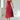 Elegant black midi dress with a square neck and sleeveless design, featuring convenient pockets. The dress is styled for a bridal party or formal occasion.