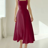 Elegant black midi dress with a square neck and sleeveless design, featuring pockets, displayed in a red wine color, size 3XL.