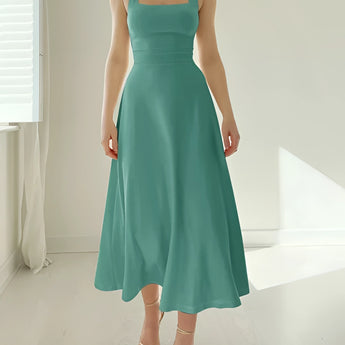 Elegant black midi dress featuring a square neckline, pockets, and a flattering silhouette, suitable for bridal parties and formal occasions.