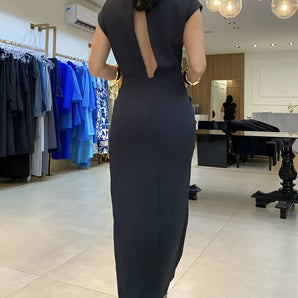 Elegant black midi dress featuring a high neckline and a stylish back cutout, designed for formal events.
