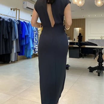 Elegant black midi dress featuring a high neckline and a stylish back cutout, designed for formal events.