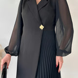 Elegant black pleated long sleeve mini dress suitable for office wear, featuring a fitted waist and a chic design.
