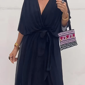 Elegant black V-neck wrap midi dress with short sleeves, showcasing a chic and stylish design perfect for summer occasions, highlighting the waist and neckline.