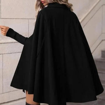 Elegant black women's hooded cape coat with a stylish winter design featuring shoulder-length sleeves and a sleek silhouette, ideal for fashionable and cozy winter wear.