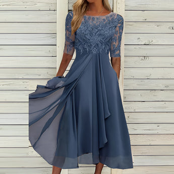 Elegant blue lace top evening dress with high-low skirt in a dark blue color, featuring a one-piece garment design with shoulder and arm coverage, suitable for formal occasions.
