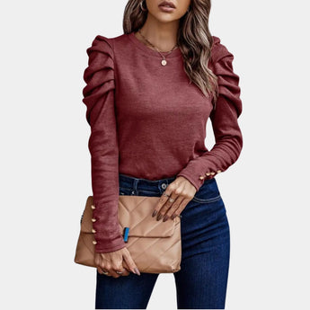 Elegant burgundy ruched sleeve sweater with slim fit puffed shoulders, showcasing detailed design elements around the neck, shoulder, and waist areas, suitable for plus-size fashion.