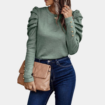 
A green, slim fit sweater with a ruched sleeve design, featuring puffed shoulders. The sweater has a crew neckline and is styled with jeans. It is displayed in a 3XL size.