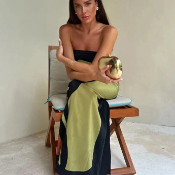 Elegant Color Block Maxi Skirt in a sophisticated design, worn by a model with black hair. The skirt features a flowing silhouette, highlighting the waist and reaching down to the ankles, ideal for evening wear.
