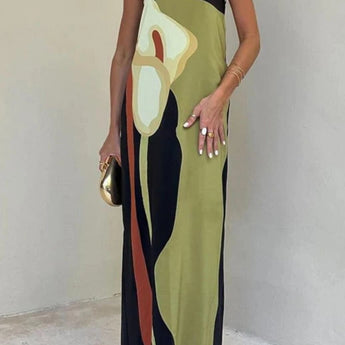 Elegant color block maxi skirt with a sophisticated evening design, featuring a high waistline and flowing silhouette. The model is wearing the skirt paired with a stylish top that has long sleeves and a neckline that complements the overall look.