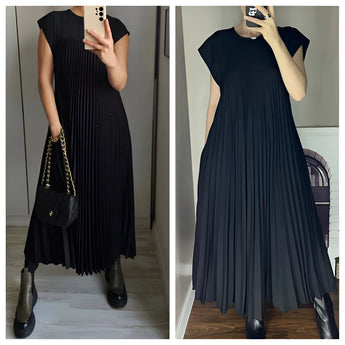Elegant gray sleeveless maxi dress with a flowy, pleated design, perfect for summer.