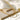 Elegant double layered gold necklace displayed on a beige background, highlighting its minimalist and delicate design.