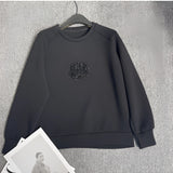 Elegant floral embroidered women's white sweatshirt featuring intricate floral designs on the front, with long sleeves and a classic round collar. The sweatshirt is styled for a fashionable yet comfortable fit, ideal for casual wear.