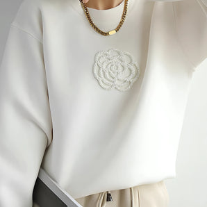 Elegant floral embroidered women's white sweatshirt with a high neckline and long sleeves, featuring intricate floral patterns adding a touch of sophistication and style.