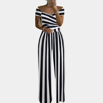 Elegant floral off-shoulder denim jumpsuit featuring a stylish off-the-shoulder neckline, fitted waist, and flowing design, suitable for women's luxury wear in size 3XL, showcasing intricate floral patterns and a sophisticated fashion statement.