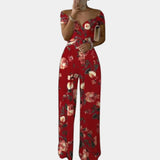 Elegant floral off-shoulder denim jumpsuit in red, featuring an off-the-shoulder design with short sleeves, cinched at the waist for a flattering fit, suitable for women's luxury wear in size 3XL.
