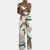 Elegant off-shoulder denim jumpsuit with a white leaves pattern in 3XL size, featuring a fitted waist, short sleeves, and thigh-length design for a fashionable and luxurious look.