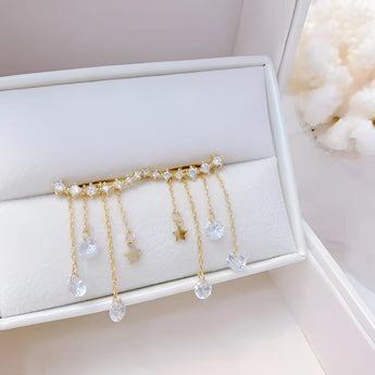 Elegant gold chain drop earrings with crystal star charms for women, featuring delicate and shimmering design, perfect for adding a touch of sophistication to any outfit.