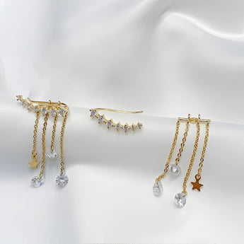 Elegant gold chain drop earrings with crystal star charms for women.