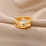 Elegant gold floral engagement ring featuring a unique diamond twist band.