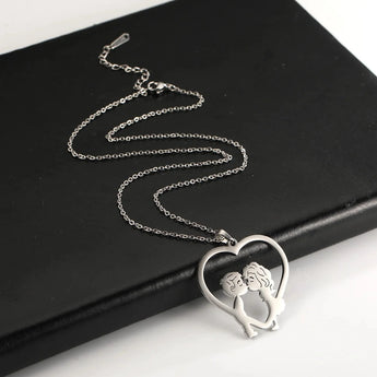 Elegant gold heart-shaped couple necklace featuring a romantic design, perfect as an anniversary gift, displayed on a neutral background.