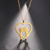 Elegant gold heart-shaped couple necklace with intricate design, perfect as a romantic anniversary gift, featuring a delicate chain.