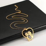 Elegant gold heart-shaped couple necklace with romantic design, perfect for an anniversary gift.