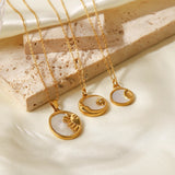 Elegant gold necklace with a mother of pearl sunburst pendant, featuring a Hamsa and celestial charm.