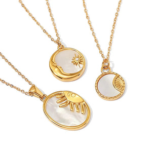 Elegant gold necklace featuring a mother of pearl sunburst pendant with Hamsa and celestial charms on a delicate chain.