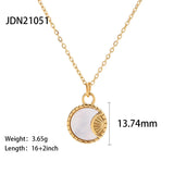 Elegant gold necklace featuring a mother of pearl sunburst design with Hamsa and celestial charms on a delicate chain.